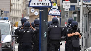Policemen stand in front of a bus stop at Hoher Markt in Vienna on November 3, 2020, one day after a shooting at multiple locations across central Vienna. (Joe Klamar/AFP)