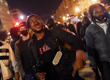 Demonstrators rally at Black Lives Matter plaza across from the White House on election night in Washington, DC on November 3, 2020. (AFP)