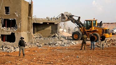 Israeli machinery demolish a Palestinian house located within the area C (where Israel retains control, including over planning and construction) in a village south of Yatta in the southern area of the West Bank town of Hebron, on November 2, 2020. (Hazem Bader/AFP)