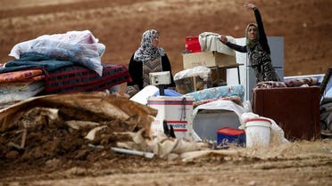 Palestinian Bedouins stand next to their belongings after Israeli soldiers demolished their tents in an area east of the village of Tubas, in the occupied West Bank, on November 3, 2020. (Jaafar Ashtiyeh/AFP)