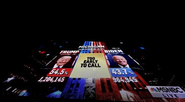 A giant television screen shows a network TV broadcast showing the presidential race in Michigan as too close to call, Nov. 3, 2020. (Reuters)