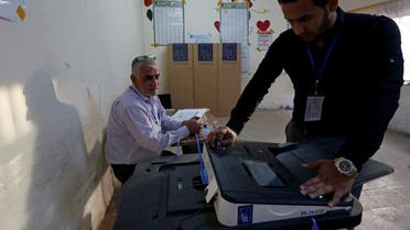 Iraq's Independent High Electoral Commission employee closes a ballot box at a polling station during the parliamentary election in the Sadr City district of Baghdad, Iraq May 12, 2018. REUTERS/Wissm al-Okili