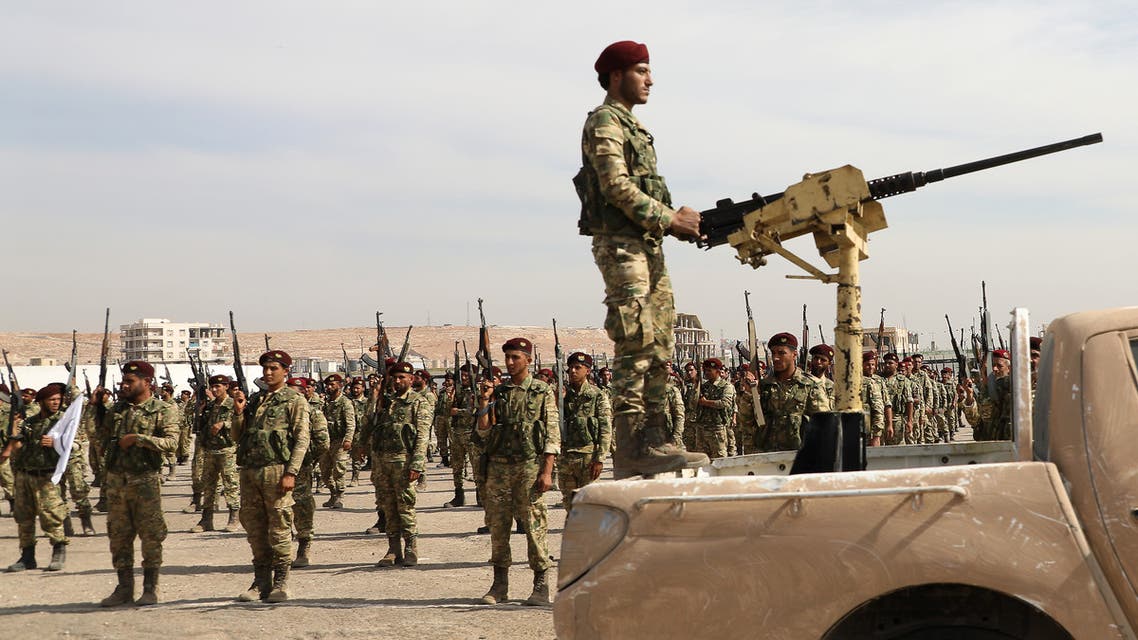 Turkish-backed Syrian rebels gather in al-Bab city in the eastern countryside of Aleppo province on October 11, 2019 as they prepare to take part in Turkey's invasion of northeastern Syria. Turkish and allied forces faced stiff Kurdish resistance as they battled to seize key border towns, on the third day of a broad offensive that sparked a civilian exodus.