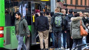 People board a bus as the coronavirus disease (COVID-19) outbreak continues in Uppsala, Sweden October 21, 2020. TT News Agency/Claudio Bresciani via REUTERS ATTENTION EDITORS - THIS IMAGE WAS PROVIDED BY A THIRD PARTY. SWEDEN OUT.