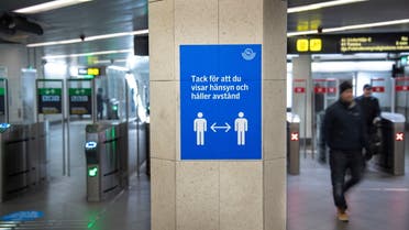 A sign encourages people using public transportation to maintain social distance in Stockholm, Sweden Nov. 4, 2020. (Reuters)