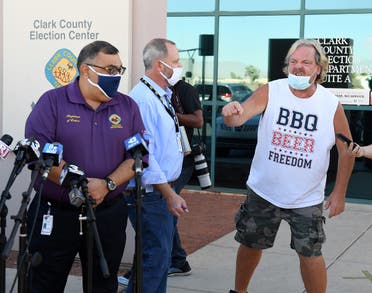 A protester interrupts a news conference by Clark County Registrar Joe Gloria (L) discussing ballot counting, Nov. 4, 2020 in Las Vegas, Nevada. (AFP)