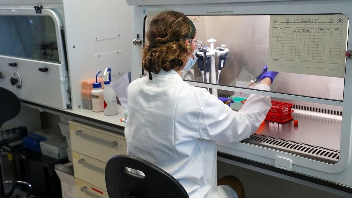 A scientist works at the manufacturing laboratory where a vaccine against the coronavirus disease has been produced at the Oxford Vaccine Group’s facility at the Churchill Hospital in Oxford, UK. (Reuters)
