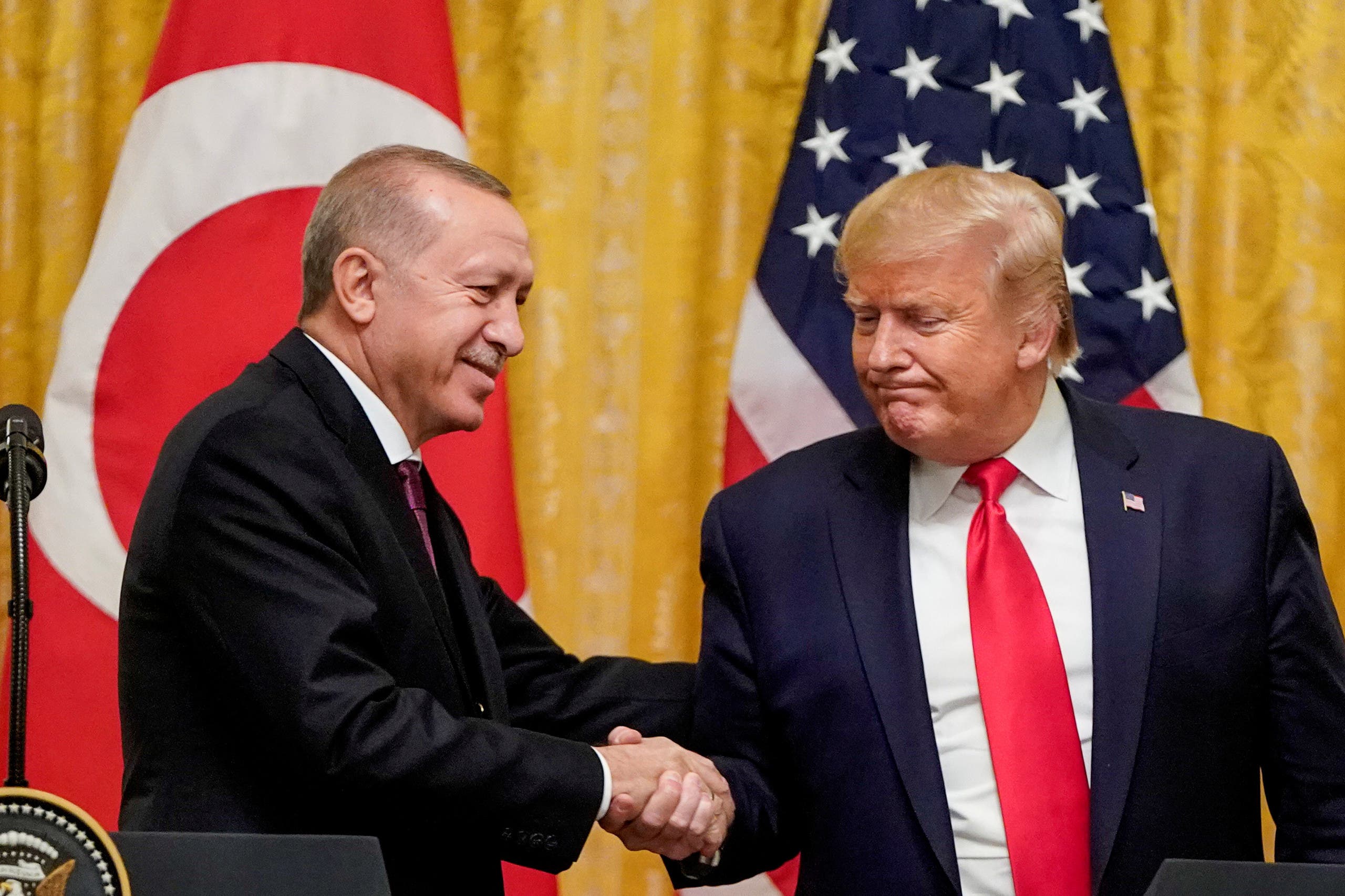 US President Donald Trump greets Turkey's President Tayyip Erdogan during a joint news conference at the White House in Washington, US, November 13, 2019. (Reuters)