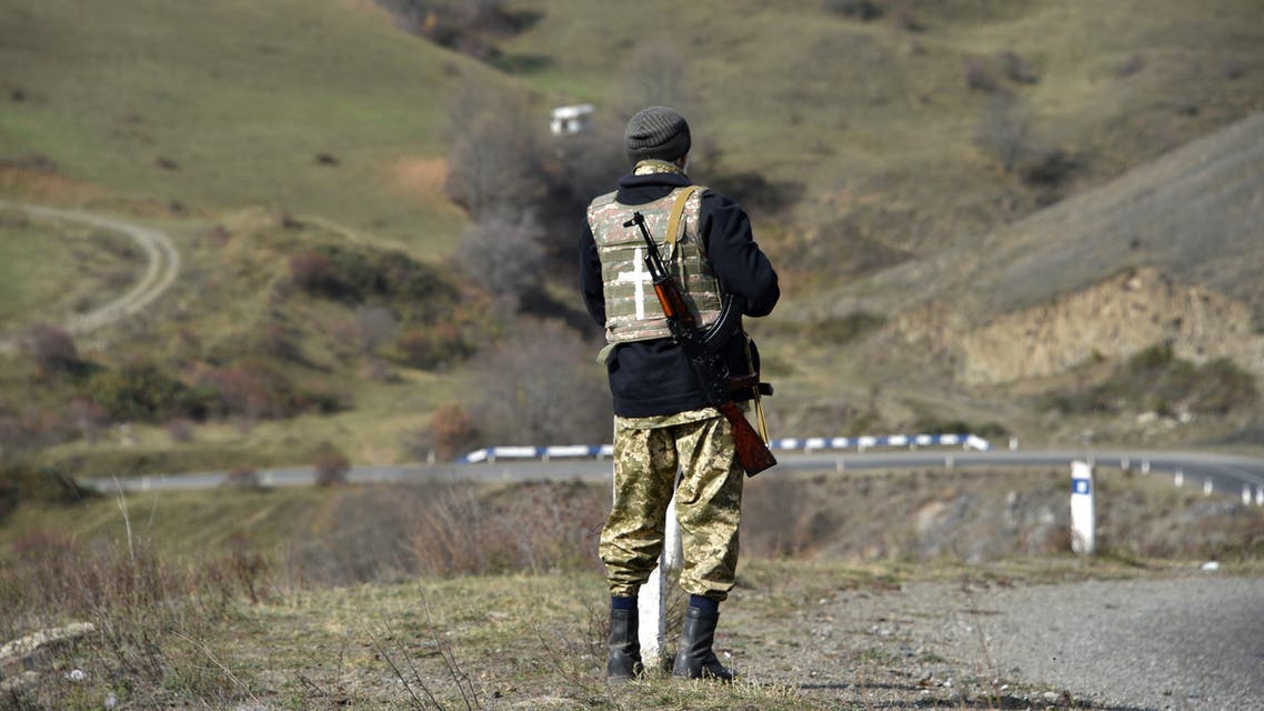 A military volunteer keeps watch in the Shusha region on October 31, 2020, amid the ongoing military conflict between Armenia and Azerbaijan over the breakaway region of Nagorno-Karabakh.