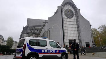 French police officers stand guard outside Notre Dame church in Lille, northern France, Sunday, Nov. 1, 2020. (AP)