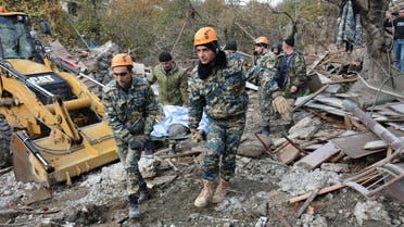 SENSITIVE MATERIAL. THIS IMAGE MAY OFFEND OR DISTURB. Rescuers carry the body of a victim following what is said to be recent shelling in the city of Stepanakert during a military conflict over the breakaway region of Nagorno-Karabakh, in this handout photo released November 6, 2020. Armenian Unified Infocentre/Handout via REUTERS ATTENTION EDITORS - THIS IMAGE HAS BEEN SUPPLIED BY A THIRD PARTY. NO RESALES. NO ARCHIVES. MANDATORY CREDIT.