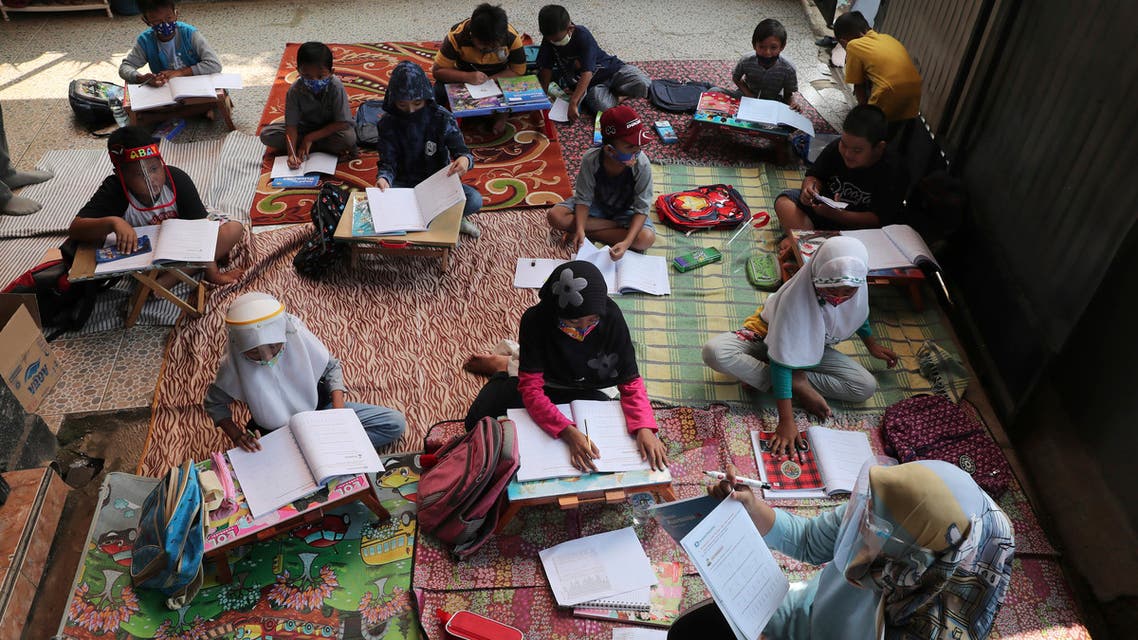 Indonesian teacher Inggit Andini, bottom right, teaches at a makeshift class for students who lack access to the internet to study online, at her residence in Tangerang, Indonesia, on Aug. 10, 2020. (AP)