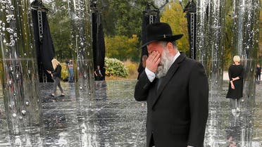 A Jewish man reacts during the opening ceremony of an installation commemorating the victims of Babyn Yar, Sept. 29, 2020. (Reuters)
