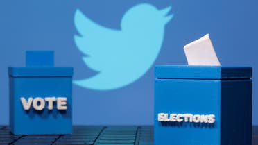 3D printed ballot boxes are seen in front of a displayed Twitter logo in this illustration taken November 4, 2020. REUTERS/Dado Ruvic/Illustration