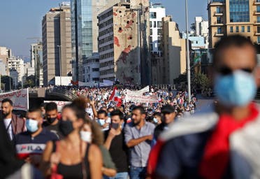 People march during a demonstration marking one year since the start of nation-wide protests in Beirut, Lebanon October 17, 2020. (Reuters)