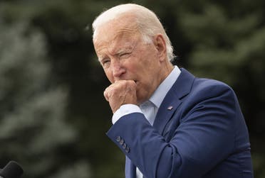 Joe Biden coughs in Warren, Michigan, on September 9, 2020. (AFP)