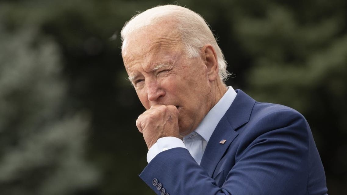 Joe Biden coughs in Warren, Michigan, on September 9, 2020. (AFP)