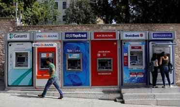 Women withdraw cash from an ATM of Halkbank in Istanbul, Turkey. (File photo: Reuters)