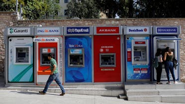 Women withdraw cash from an ATM of Halkbank in Istanbul, Turkey, September 12, 2017. (Reuters)