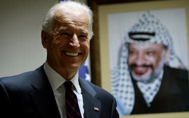 Then-US Vice President Joe Biden stands in front of a picture of late Palestinian leader Yasser Arafat in the West Bank city of Ramallah on March 10, 2010. (File photo: AP)