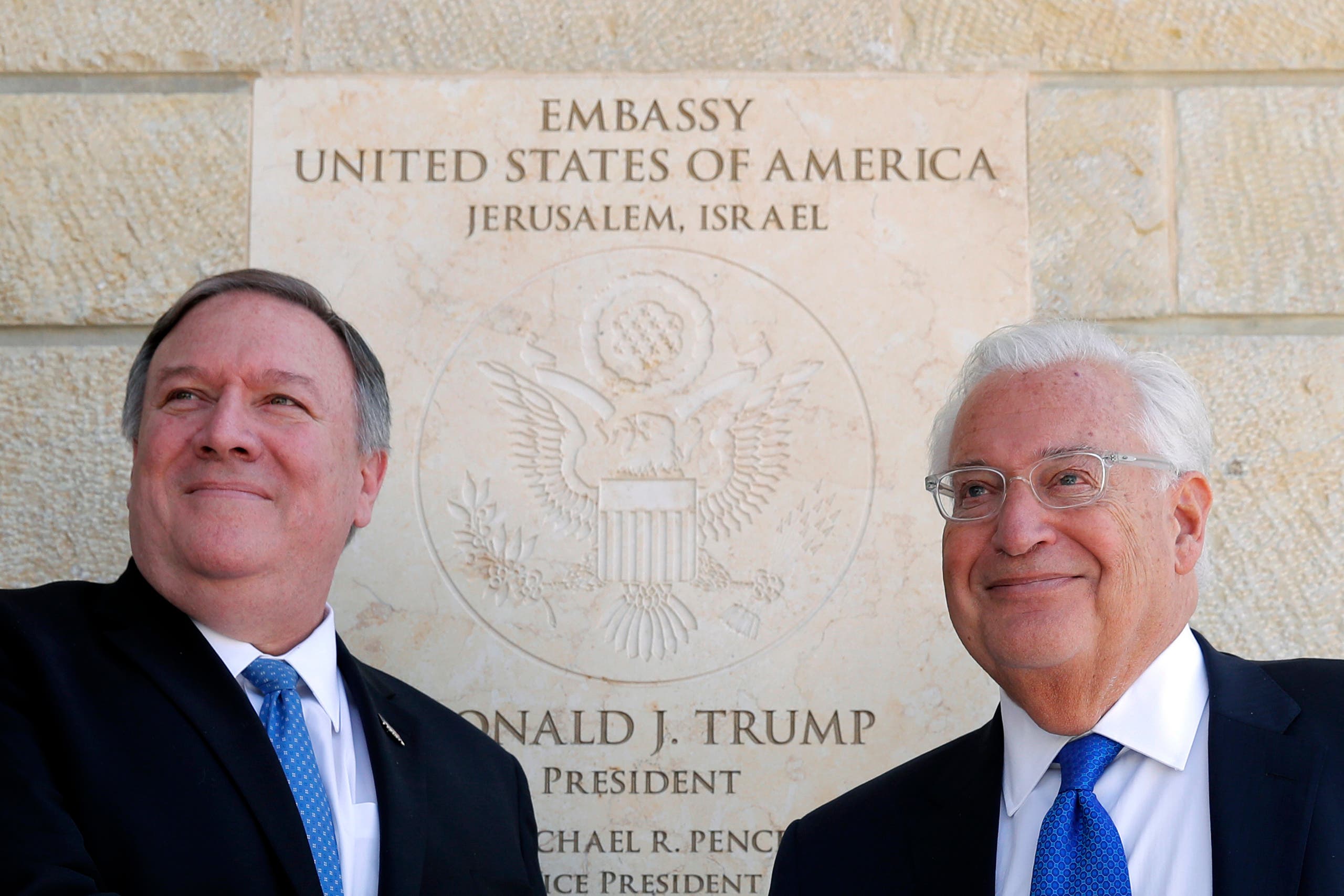 US Secretary of State Mike Pompeo and US Ambassador to Israel David Friedman stand next to the dedication plaque at the US embassy in Jerusalem on March 21, 2019. (AP)