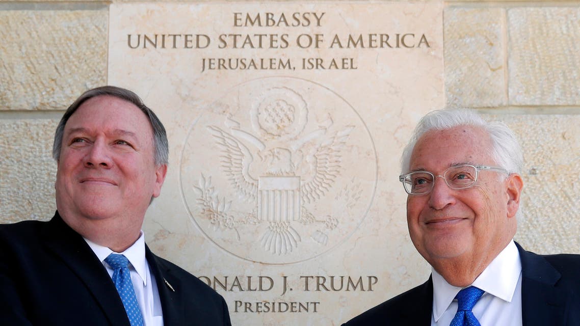 US Secretary of State Mike Pompeo and US Ambassador to Israel David Friedman stand next to the dedication plaque at the US embassy in Jerusalem on March 21, 2019. (AP)