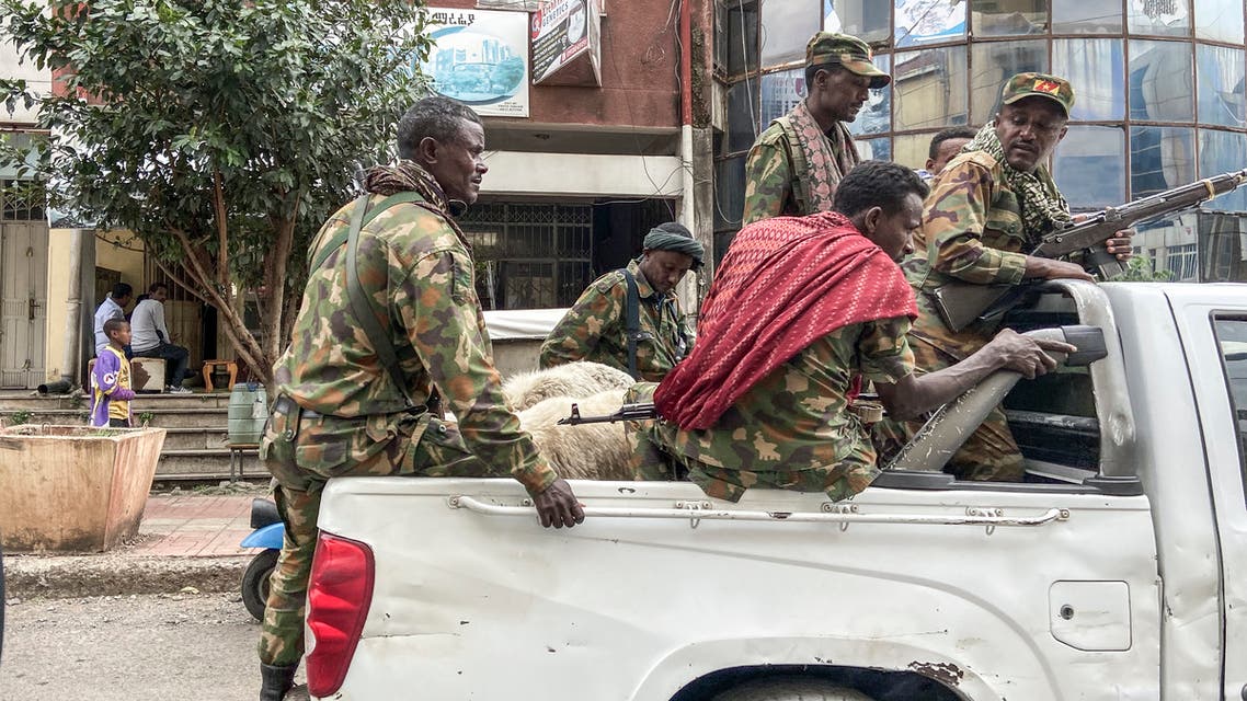 Members of the Amhara militia, that combat alongside federal and regional forces against northern region of Tigray, ride on the back of a pick up truck in the city of Gondar, on 08 November 2020.