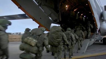 A still image from a video released by the Russian Defense Ministry shows Russian peacekeepers boarding a plane before departing for the region of Nagorno-Karabakh at an airdrome in Ulyanovsk, Russia November 10, 2020. (Russian Defense Ministry/Handout via Reuters TV)