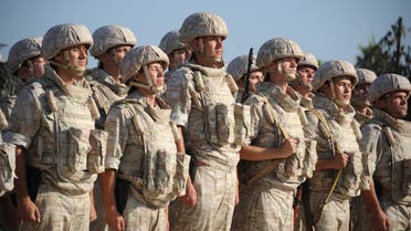 Russian soldiers line up in front of their commander at the Russian military base of Hmeimim, located south-east of the city of Latakia in Hmeimim, Latakia Governorate, Syria, on September 26, 2019. (AFP)