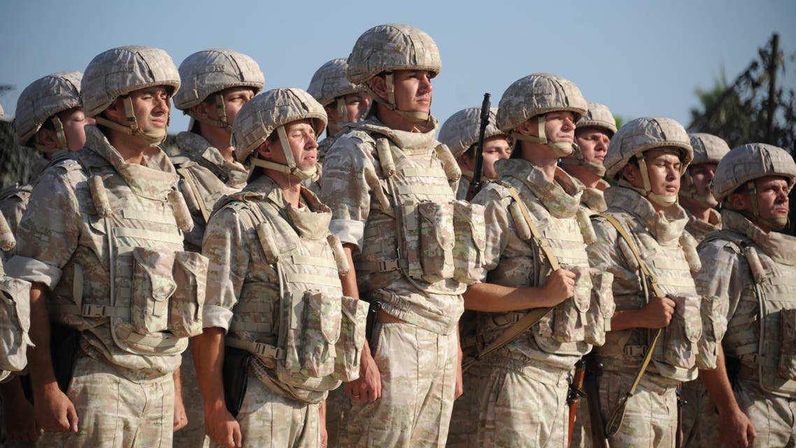 Russian soldiers line up in front of their commander at the Russian military base of Hmeimim, located south-east of the city of Latakia in Hmeimim, Latakia Governorate, Syria, on September 26, 2019. (AFP)