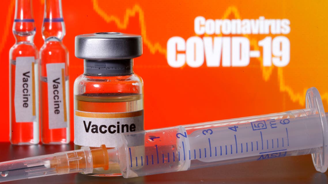 Small bottles labelled with Vaccine stickers stand near a medical syringe in front of displayed Coronavirus COVID-19 words in this illustration taken April 10, 2020. (Reuters)