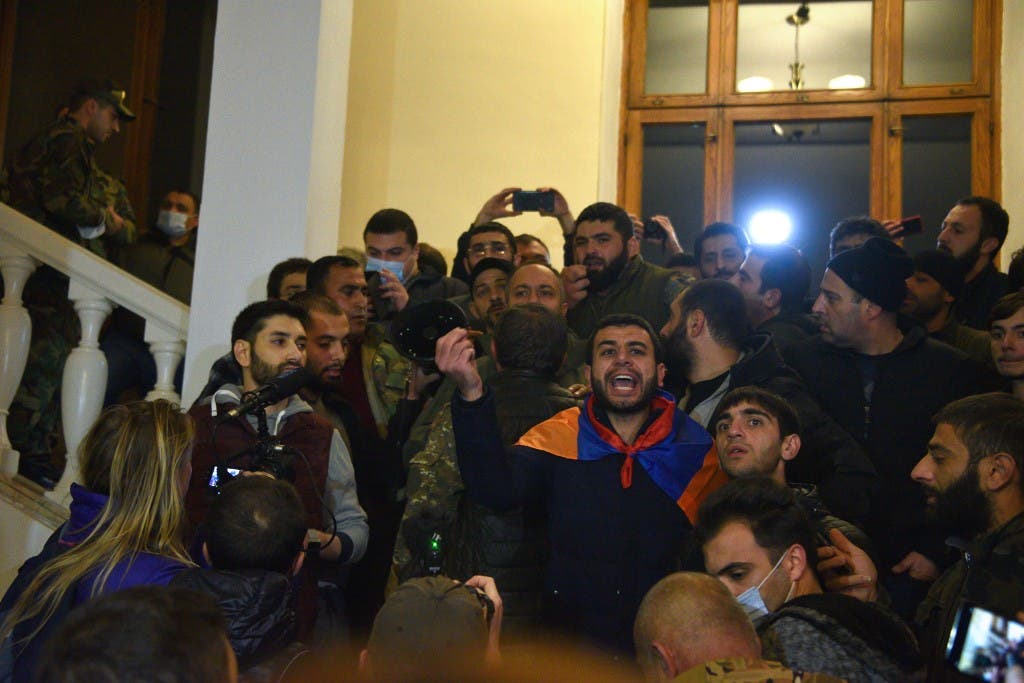 Armenians protest against the country's agreement to end fighting with Azerbaijan over the disputed Nagorno-Karabakh region inside the government headquarters in Yerevan on November 10, 2020. (AFP)