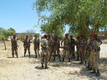A picture taken on March 2, 2012 shows Ethiopian soldiers receiving a briefing before displaying of weapons left behind by Shebab militias at their former base in Baido, Somalia, which was taken over from al Shabab rebels on February 22. (AFP/Jenny Vaughan)