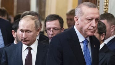 Russian President Vladimir Putin and his Turkish counterpart Recep Tayyip Erdogan arrive to hold a joint press statement following their talks at the Kremlin in Moscow on March 5, 2020. (AFP)