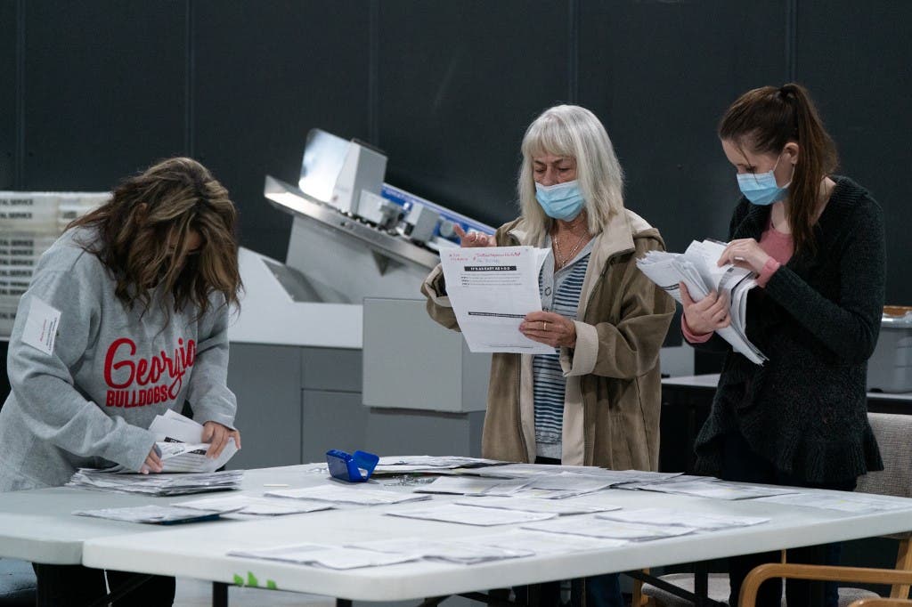 Election personnel sort absentee ballot applications for storage at the Gwinnett County Board of Voter Registrations and Elections offices on November 7, 2020 in Lawrenceville, Georgia. (AFP)
