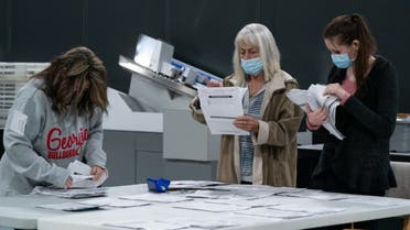 Election personnel sort absentee ballot applications for storage at the Gwinnett County Board of Voter Registrations and Elections offices on November 7, 2020 in Lawrenceville, Georgia. (AFP)