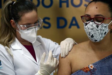 A nurse administers China’s Sinovac vaccine to a volunteer at the Sao Lucas Hospital of the Pontifical Catholic University of Rio Grande do Sul (PUCRS), in Porto Alegre, Brazil, August 8, 2020. (Reuters)