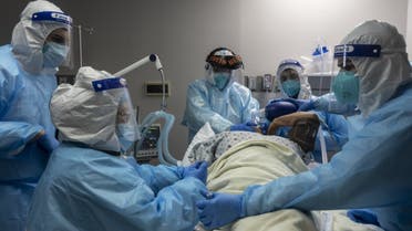 Medical staff members treat a patient suffering from coronavirus in the COVID-19 intensive care unit (ICU) on November 10, 2020 in Houston, Texas. (AFP)