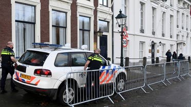 Police officers stand near the Embassy of Saudi Arabia after unidentified assailants sprayed it with gunfire, in The Hague, Netherlands November 12, 2020. (Reuters)