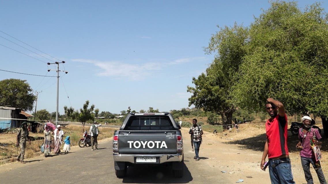 Members of Amhara militia control a motor vehicle checkpoint at the entrance of Dansha town in Tigray Region, Ethiopia November 9, 2020. (Reuters)