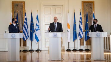 Greek Foreign Minister Nikos Dendias, centre, speaks during a join news conference next to his Israel's counterpart Gabi Ashkenazi, right, and Cypriot Foreign Minister Nikos Christodoulides, left, after their meeting in Athens, on Tuesday, Oct. 27, 2020. (AP)
