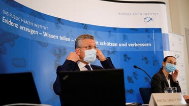 Head of Robert Koch Institute, German national agency and research institute, responsible for disease control and prevention, Lothar Wieler, left, and Ute Rexroth, a senior RKI official arrive for a news conference on the coronavirus situation in Berlin, Germany, on November 12, 2020. (Reuters)