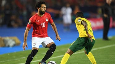 Egypt's forward Mohamed Salah (L) is marked by South Africa's midfielder Thembinkosi Lorch, July 6, 2019. (AFP)