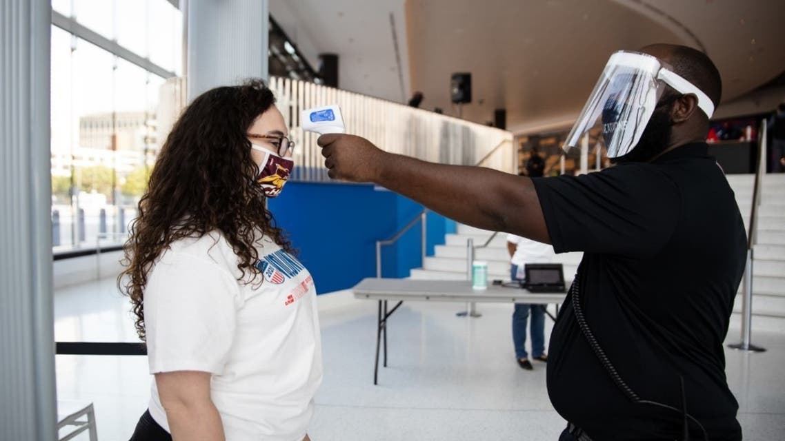 COVID-19 temperature checks are given to voter registrants before entering Rocket Mortgage Fieldhouse where a voter registration event took place on September 21, 2020 in Cleveland, Ohio. (AFP)