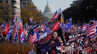 Trump loyalists gather as US president drives through Washington