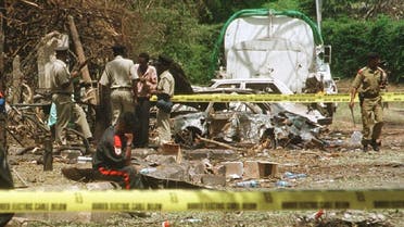 Policemen check debris US embassy building that was bombed Aug. 7, 1998 in Dar es Salaam, Tanzania. (AFP)