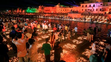 People light lamps on the banks of river Saryu in Ayodhya, India, Friday, Nov. 13, 2020. (AP)