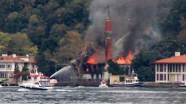 A fire engulfs Vanikoy Mosque, a historic wooden mosque, in Istanbul, Sunday, Nov. 15, 2020. (DHA via AP)
