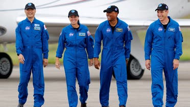 FILE PHOTO: NASA astronauts Shannon Walker, Victor Glover, Mike Hopkins, and JAXA (Japan Aerospace Exploration Agency) astronaut Soichi Noguchi, who comprise Crew-1, walk at Kennedy Space Center ahead of the NASA/SpaceX launch of the first operational commercial crew mission in Cape Canaveral, Florida, U.S., November 8, 2020. REUTERS/Joe Skipper/File Photo