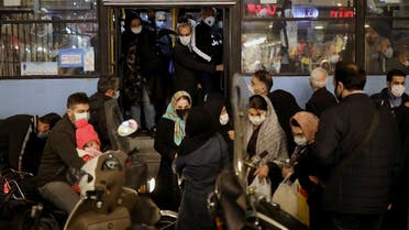Iranians wearing protective masks are pictured at a bus, amid the outbreak of the coronavirus disease in Tehran, Iran November 11, 2020. (Majid Asgaripour/WANA (West Asia News Agency) via Reuters)